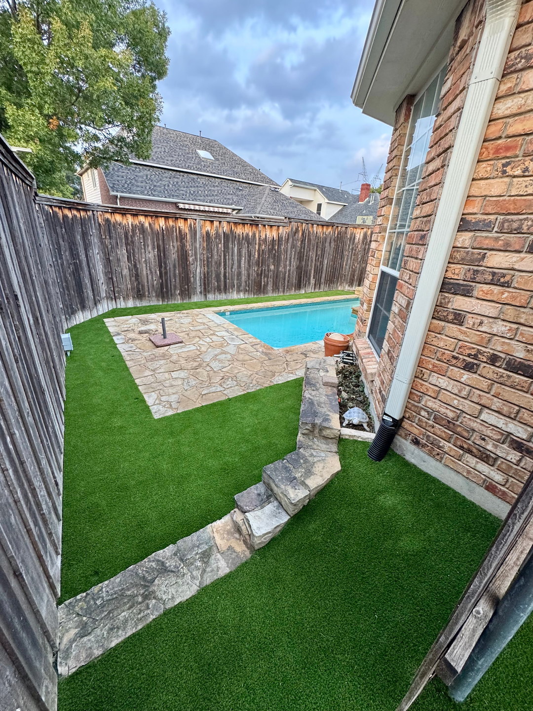 Pet-Friendly Artificial Turf Installation Around Pool and Side Yard in Plano, TX